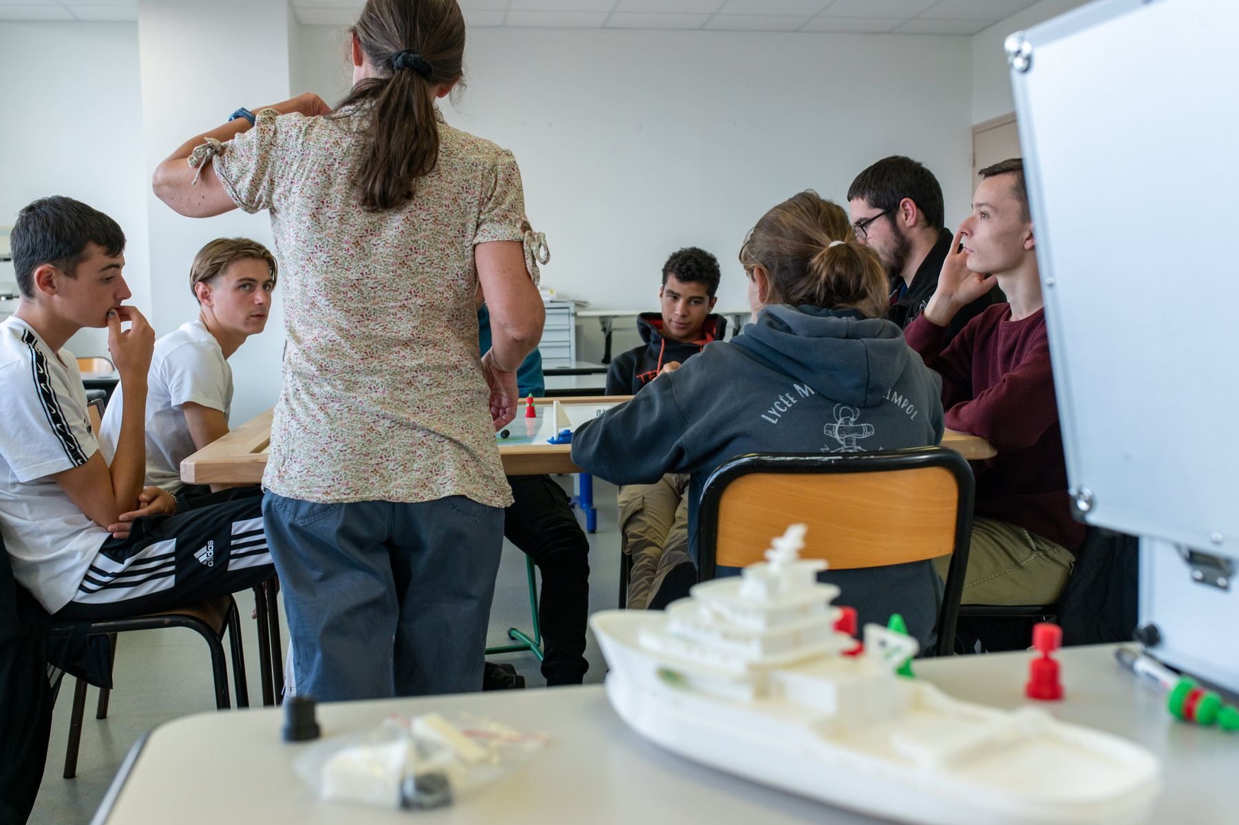 Large 3D-printed ship model in a classroom