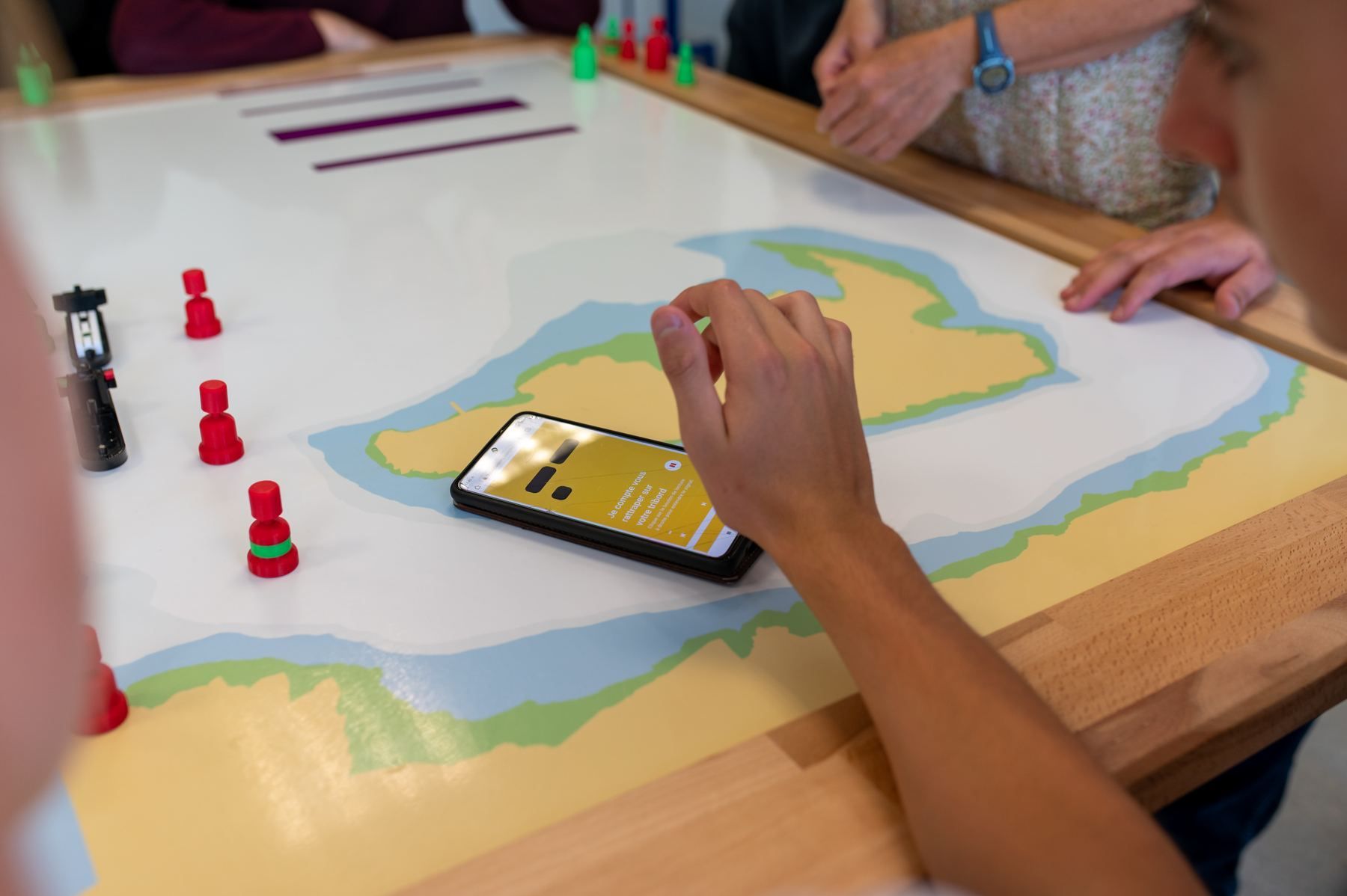 Smartphone placed on the board above a connected piece
